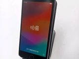 a cell phone that is sitting on top of a stand