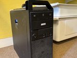 a black computer tower sitting on the floor in a room