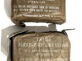 an old army first aid dressing bag and an old army first aid dressing bag