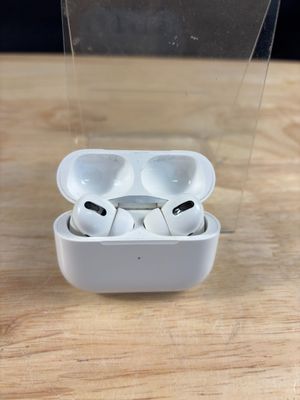 an apple airpods are sitting in a clear box on a wooden table