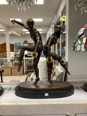 a statue of a man and a woman on a table