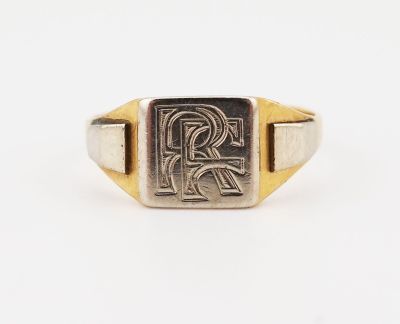 a gold and silver signet ring with the letter r on it