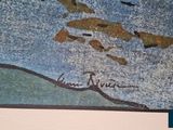 a picture of a painting of a map of the world on the wall