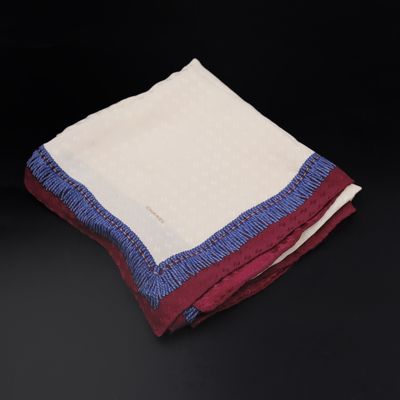 a close up of two folded towels on a black surface