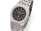 a close up of a watch on a white surface with a white background