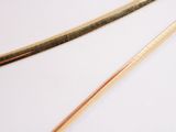 two chopsticks sitting next to each other on a table