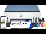 hp desk printer with a phone and printer cartridges next to it