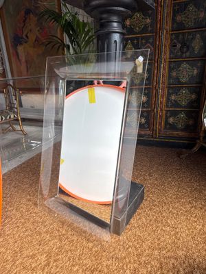 a glass display case with a picture inside of it