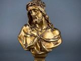 a bronze bust of jesus with a crown of thorns on his head