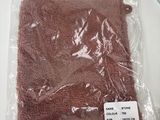a bag of brown cloth sitting on a table next to a pair of scissors
