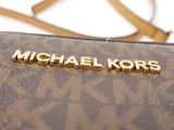 a michael kors handbag with the name michael kors on it