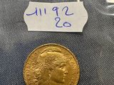 a close up of a gold coin in a plastic bag