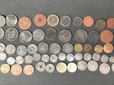a lot of coins that are on the table