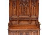 an image of a wooden bench with carvings on the back