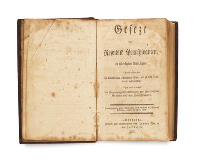 an old book opened to show the title of a poem