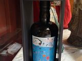 a bottle of wine that is in a box on a table