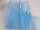 a bag of blue plastic bags sitting on a table