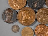 a lot of coins that are laying on a table