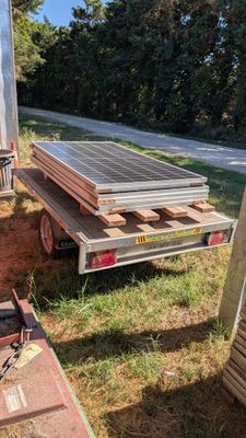 a truck that has a solar panel on the back of it
