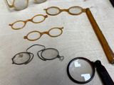 a pair of glasses, a pair of glasses, a pair of glasses, and a pair of glasses on a table