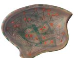 an image of a ceramic bowl with orange dots on it