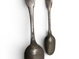 pair of antique spoons on a white background