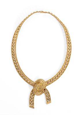 an image of a gold necklace with a knot on it