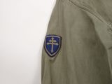 an image of a military jacket with a cross on the back