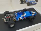 a model of a racing car on display in a glass case
