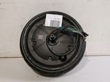a close up of a speaker with wires attached to it