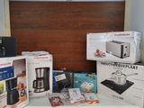 many boxes of kitchen appliances sitting on a counter