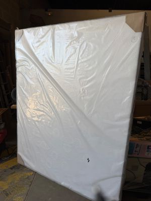 a picture of a mattress that is in a garage