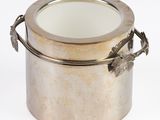 a silver container with a mirror in it on a white surface
