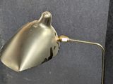 a metal lamp that is on a table