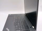 a laptop that is sitting on a white surface
