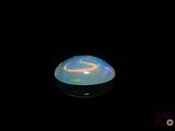 an image of a white oplite in the dark