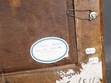 a picture of an old wooden cabinet with a sticker on it