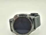 a close up of a watch on a white surface