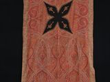 an orange and black scarf with a black butterfly on it