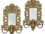 pair of antique brass wall sconces with mirrors and candle holders