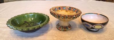 three bowls sitting on a table next to each other