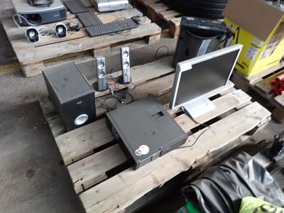 a lot of electronic equipment sitting on a pallet