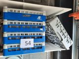 a blue and white bus that is sitting on a shelf