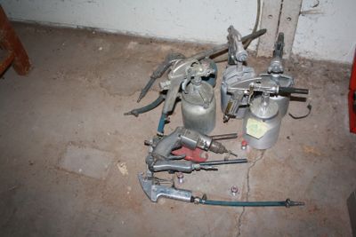 a lot of tools sitting on the floor in the room