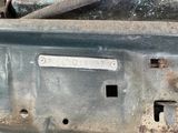 a close up of a metal object with a wren on it