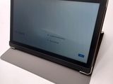 a tablet computer sitting on top of a table