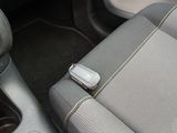 a cell phone in the center of a car seat