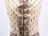 a close up of a mannequin torso with a floral pattern on it