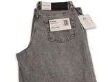 a close up of a pair of grey jeans on a white background