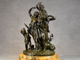 a bronze statue of a woman and two children on a marble base